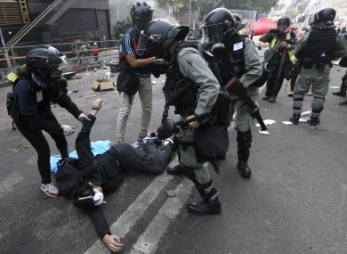 Riot police detain a protester at Hong Kong Polytechnic University this week.