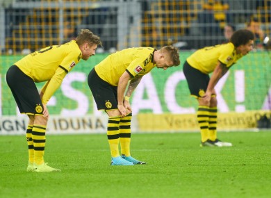 Marco Reus, Lukasz Piszczek and Axel Witsel react at full-time.