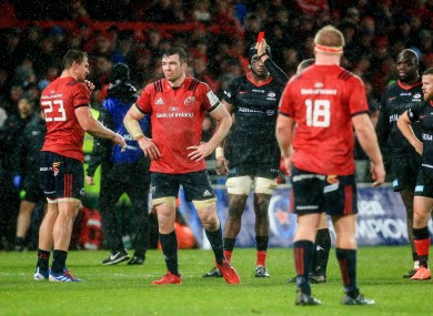 Referee Roman Poite produces a red card for Arno Botha in Munster's win against Saracens on Saturday.