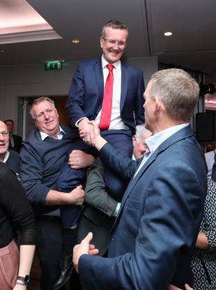 Tim Cullinan celebrating his win while being congratulated by his closest rival in the contest John Coughlan.