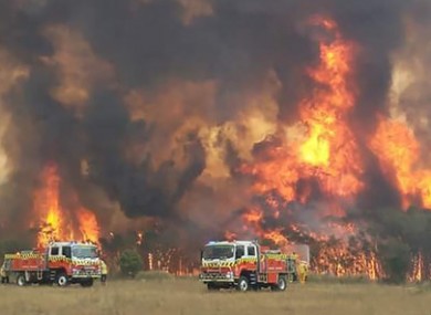 An image posted on the New South Wales fire service Twitter page shows firefighters struggling to protect homes in the area.