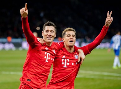 Lewandowski celebrates with team-mate Phillippe Coutinho.