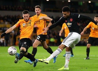 Mason Greenwood gets a shot off against Wolves