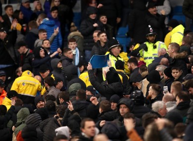 Fans collide during the second leg of the Manchester derby.