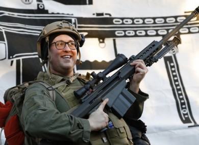 A demonstrator stands outside a security zone before a pro-gun rally in Virginia.