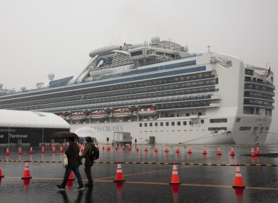 Visitors walking past the quarantined Diamond Princess cruise ship last Sunday.