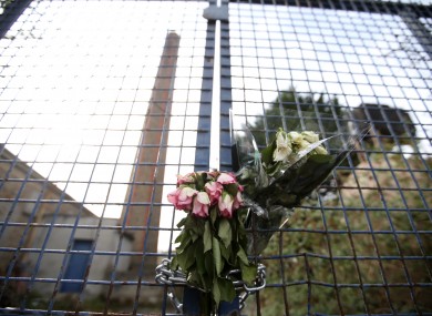 Flowers hang on the gates of the site of the former Magdalene Laundry in Donnybrook.