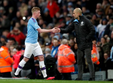 Guardiola (right) with Kevin De Bruyne.
