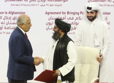 US peace envoy Zalmay Khalilzad and the Taliban's political leader Mullah Abdul Ghani Baradar.