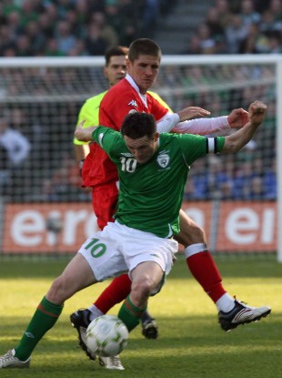 Carl Robinson tangling with Robbie Keane during the European Championship qualifier between the Republic of Ireland and Wales at Croke Park in March 2007.