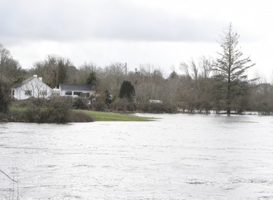 O’Briens Bridge in Co Clare just down river from the Parteen weir where the Shannon has burst its banks on the Limerick side near the village of Montpelier.