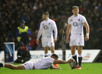 Owen Farrell stands over a kick in awful conditions.