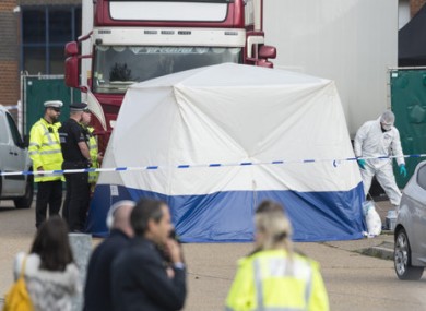 Police officers at the scene in October where the bodies were found.