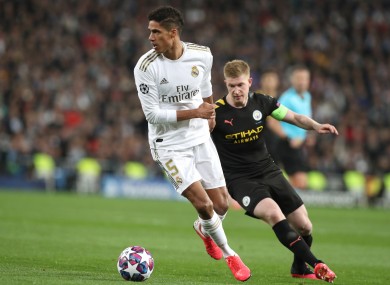 Raphael Varane and Kevin De Bruyne in action in the first leg meeting between Madrid and City.