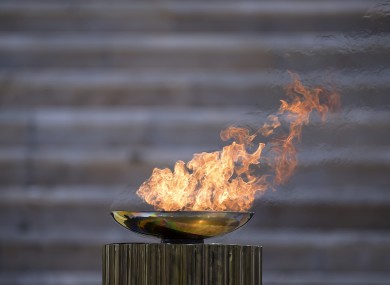 The Olympic flame burns in a cauldron during the Olympic flame handover ceremony for the 2020 Tokyo Summer Olympics.