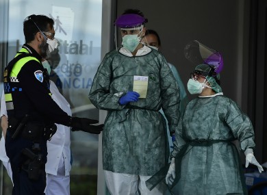 Police talk with staff health members at San Pedro hospital in Logrono, northern Spain