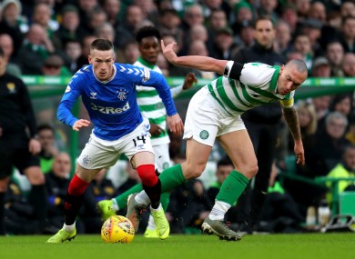 Ryan Kent of Rangers tangles with Celtic's Scott Brown during the Scottish Premiership game between the clubs in December.