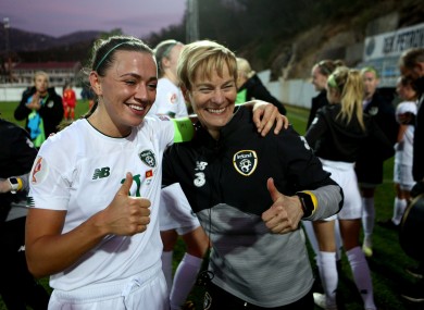 Katie McCabe and Vera Pauw celebrate after Ireland's win in Montenegro.
