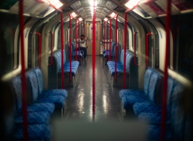 A man sits on in a near empty Central Line carriage as the UK continues in lockdown to help curb the spread of the coronavirus.