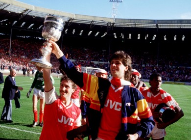Sansom (left) holds the League Cup along with his friend, Niall Quinn.
