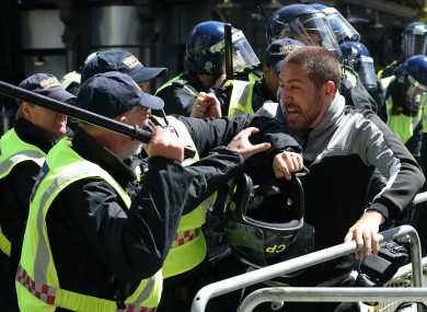 Police clash with protesters in London today.