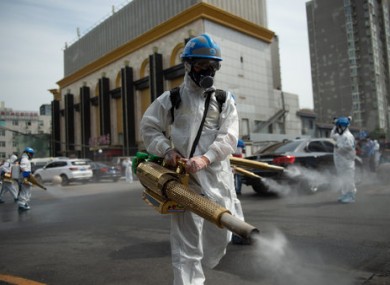 Disinfection teams in the Yuegezhuang wholesale market.