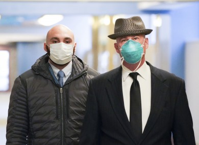 Former Minneapolis police officer J Alexander Kueng (left) enters the Hennepin County Public Safety Facility in Minneapolis yesterday.