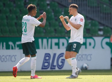 Theodor Gebre Selassie and Milos Veljkovic celebrate a Bremen goal.