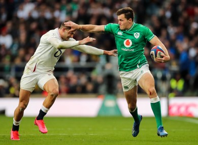 Jacob Stockdale fends off Jonny May during the Six Nations game between England and Ireland at Twickenham in February.