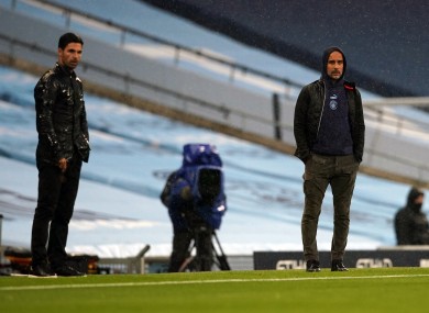 Pep Guardiola and Mikel Arteta during the Premier League match at the Etihad Stadium.