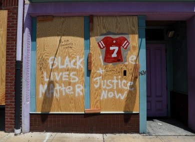 BLM: Colin Kaepernick's jersey is painted on a boarded-up business in downtown Cincinnati.
