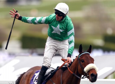 Davy Russell on board Presenting Percy celebrates victory at Cheltenham.