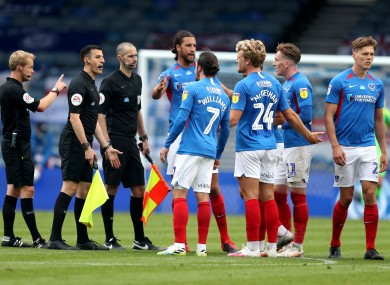 Ronan Curtis and Portsmouth team-mates remonstrate with the officials after their game against Oxford United.