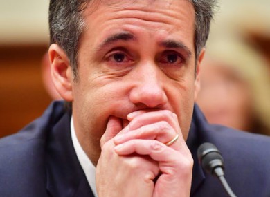 Michael D. Cohen reacts in tears while testifying before Congress.