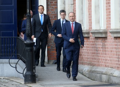 Taoiseach Micheál Martin (right), with acting chief medical officer Dr Ronan Glynn and Tánaiste Leo Varadkar behind him.
