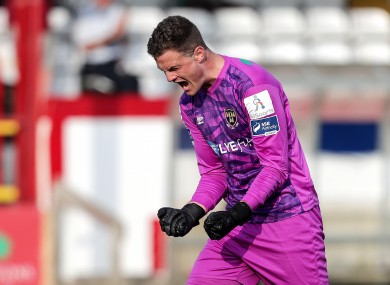 All square: Shels keeper Colin McCabe celebrates Brennan's equaliser.