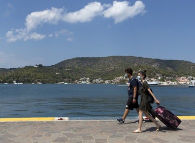 Visitors wearing face masks on the Greek island of Poros.