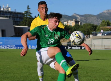 Simon Power under pressure from Iago during the meeting of the U21 teams of Ireland and Brazil in the semi-final of last year's Toulon Tournament.