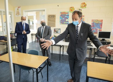 Taoiseach Micheál Martin (left) with Deputy Principal Nicholas O’Keefe and Principal Jim O’Sullivan at Nagle Secondary Community College in Mahon in Cork last week.