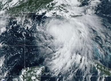 Tropical Storm Sally is shown churning northwards yesterday