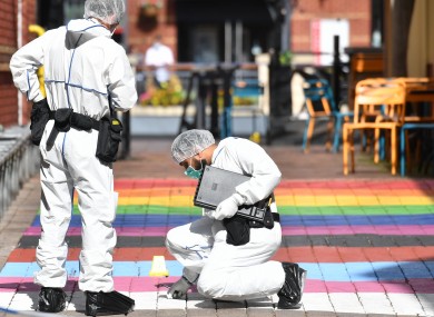 Police forensic officers in Hurst Walk in Birmingham yesterday after a number of people were stabbed in the city centre.