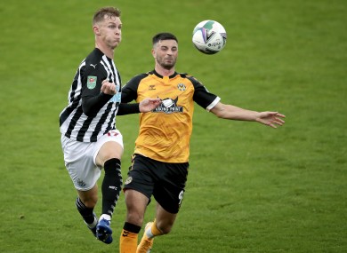Newcastle United's Emil Krafth is put under pressure by Padraig Amond of Newport County.