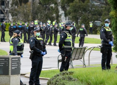 Police on the lookout at a protest against coronavirus regulations in Melbourne, Australia.