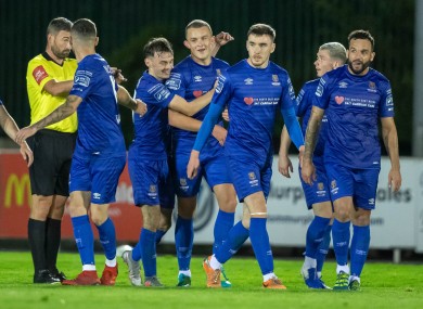 Waterford’s Michael O'Connor celebrates scoring their third goal with team-mates.