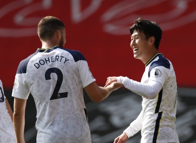 Son Heung-min is congratulated by Matt Doherty after scoring Tottenham's fourth goal against Southampton.