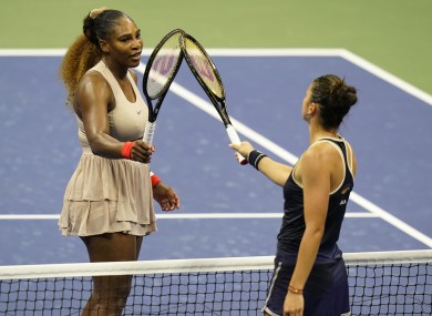 Serena Williams taps rackets with Margarita Gasparyan.