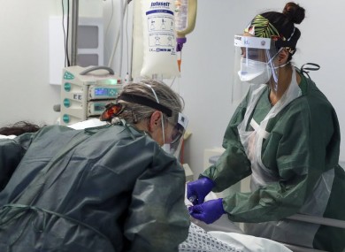 File photo of healthcare workers looking after a patient.