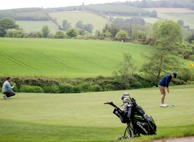Members of the public playing golf at Bunclody golf club while adhering to social distancing.