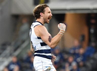 Zach Tuohy celebrates after scoring a goal for Geelong in today's victory against Collingwood.