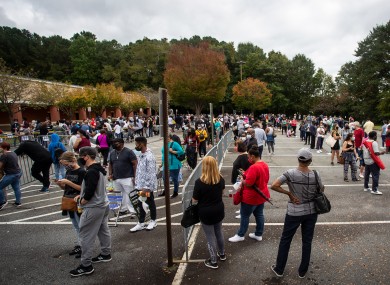 Hundreds of people wait for early voting in Marietta, Georgia